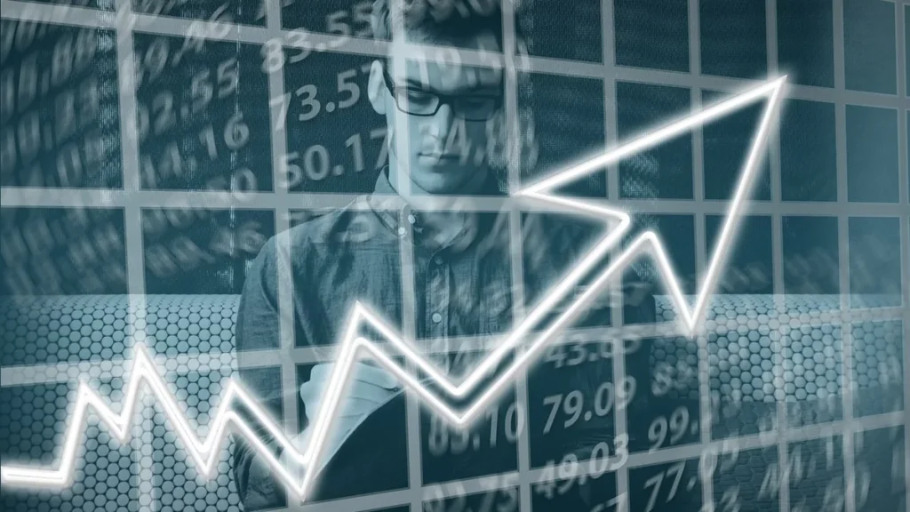 A businessman overlaid with a grid of financial numbers and a glowing white upward-trending arrow graph.