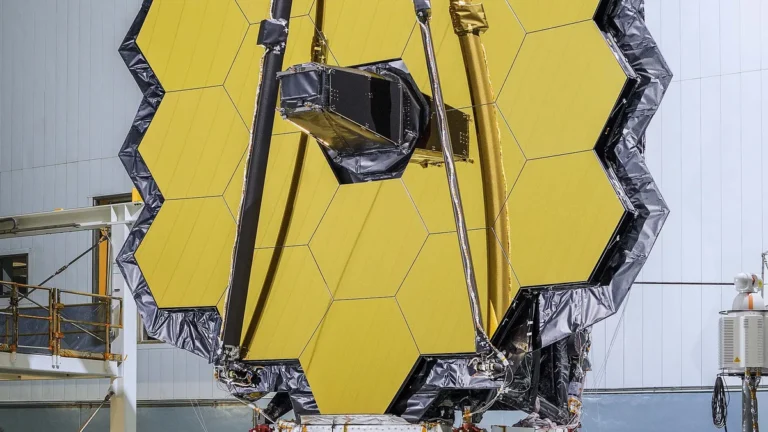 The golden hexagonal primary mirror segments of the James Webb Space Telescope.