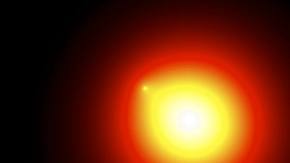 An abstract glowing red and yellow sphere with a small bright dot on its edge against a dark background.