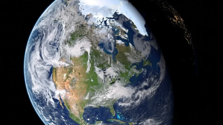 A detailed view of Earth showing North America, cloud patterns, and the transition to night.