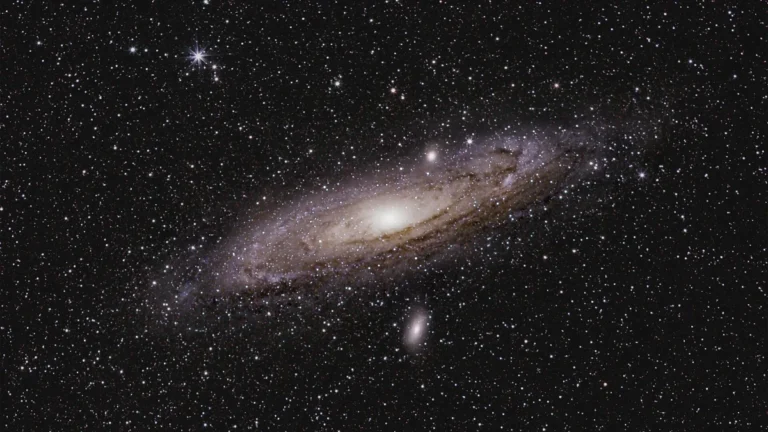 Andromeda Galaxy shines with a bright core and dusty spiral arms amidst a dense field of stars.
