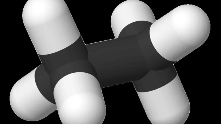 Space-filling molecular model of ethane (C2H6), featuring two black carbon atoms bonded to six white hydrogen atoms.