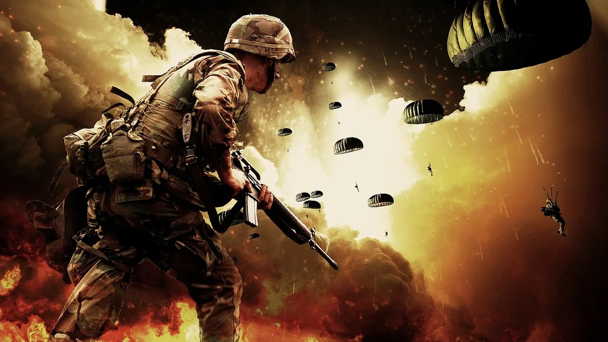 Soldier in combat gear on a battlefield with parachutes in a smoky sky, symbolizing military deployment.
