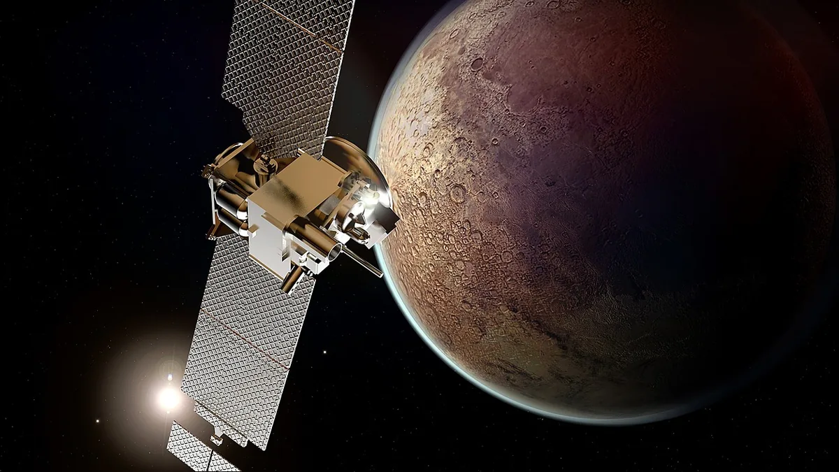 Artist's rendering of a gold and white spacecraft with solar panels orbiting a cratered, reddish-brown moon.