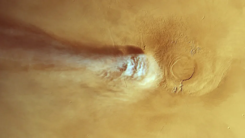A massive water-ice cloud trail stretches downwind of the Arsia Mons volcano on Mars.