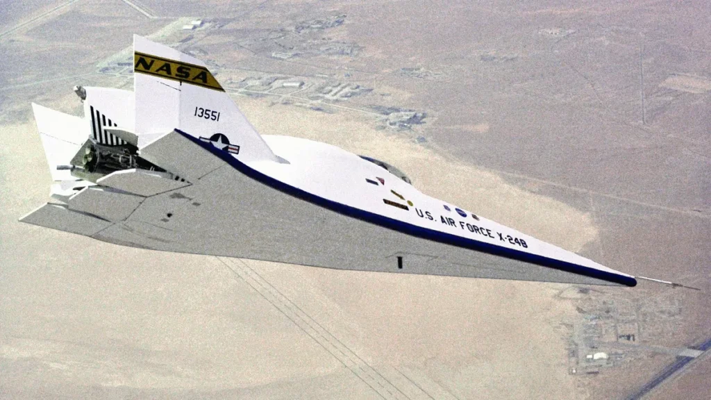 NASA X-24B lifting body experimental aircraft flying over a desert landscape, showcasing spaceplane technology.