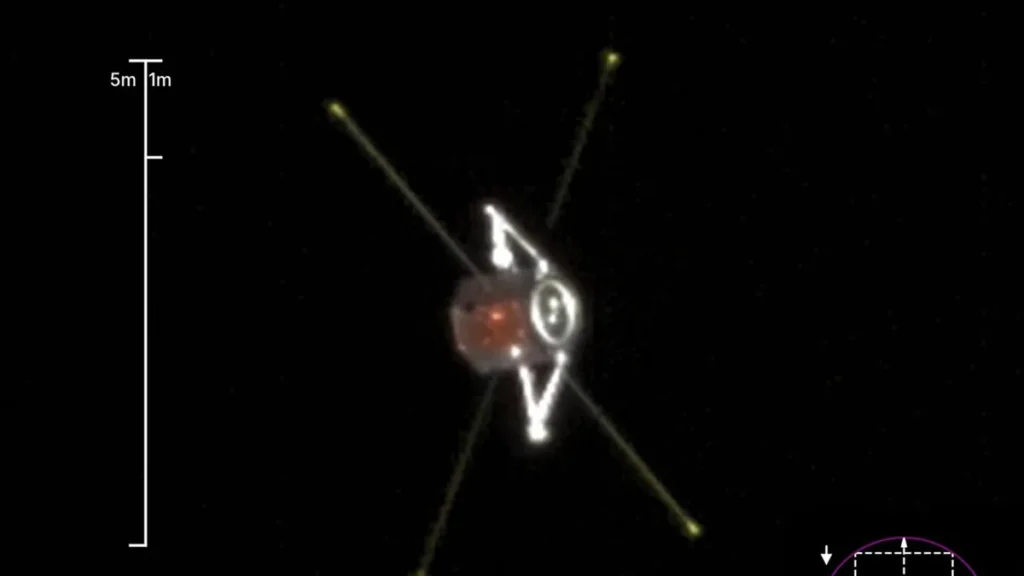Visualization of a TRACERS satellite with long sensor booms and a scale bar on a black background.