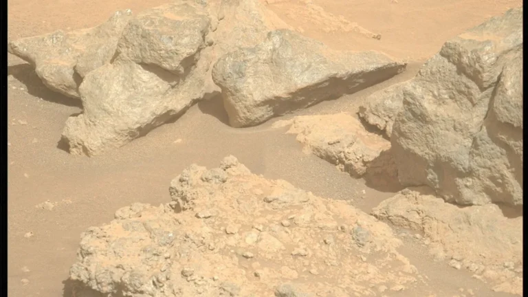 Dusty Martian rocks showing the geological contact at Tinga near the Jezero crater rim.