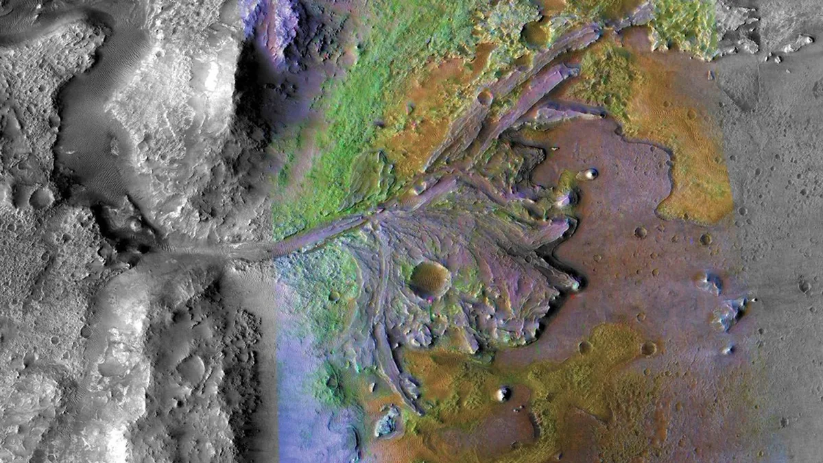 Colorful multispectral orbital image of a Martian river delta, showing vibrant green, purple, and orange geological layers.