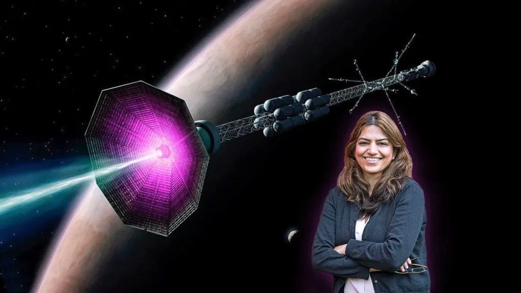 A smiling female scientist stands before an artist's impression of a futuristic purple-propelled spacecraft traveling near a