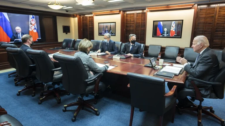 President Biden meets with his national security team in the Situation Room with Vladimir Putin on screens.