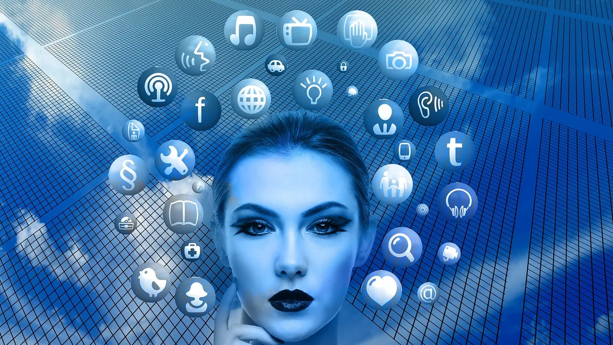 A woman surrounded by glowing blue communication and social media icons against a grid and sky background.