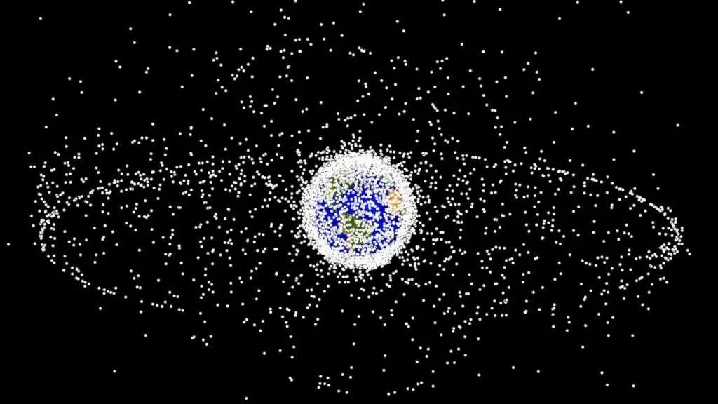 Visualization of space debris as white dots densely surrounding Earth, representing orbital junk.