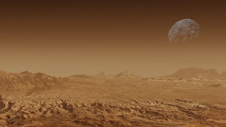 A rendered orange Martian landscape with rugged terrain and a large cratered moon in the hazy sky.